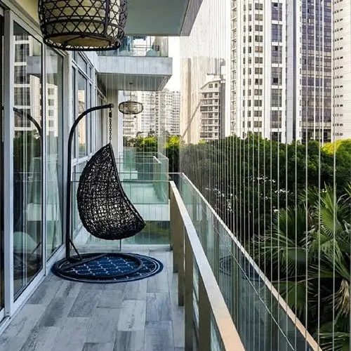 Invisible grill installed on a high-rise balcony in Mumbai with a clear city view